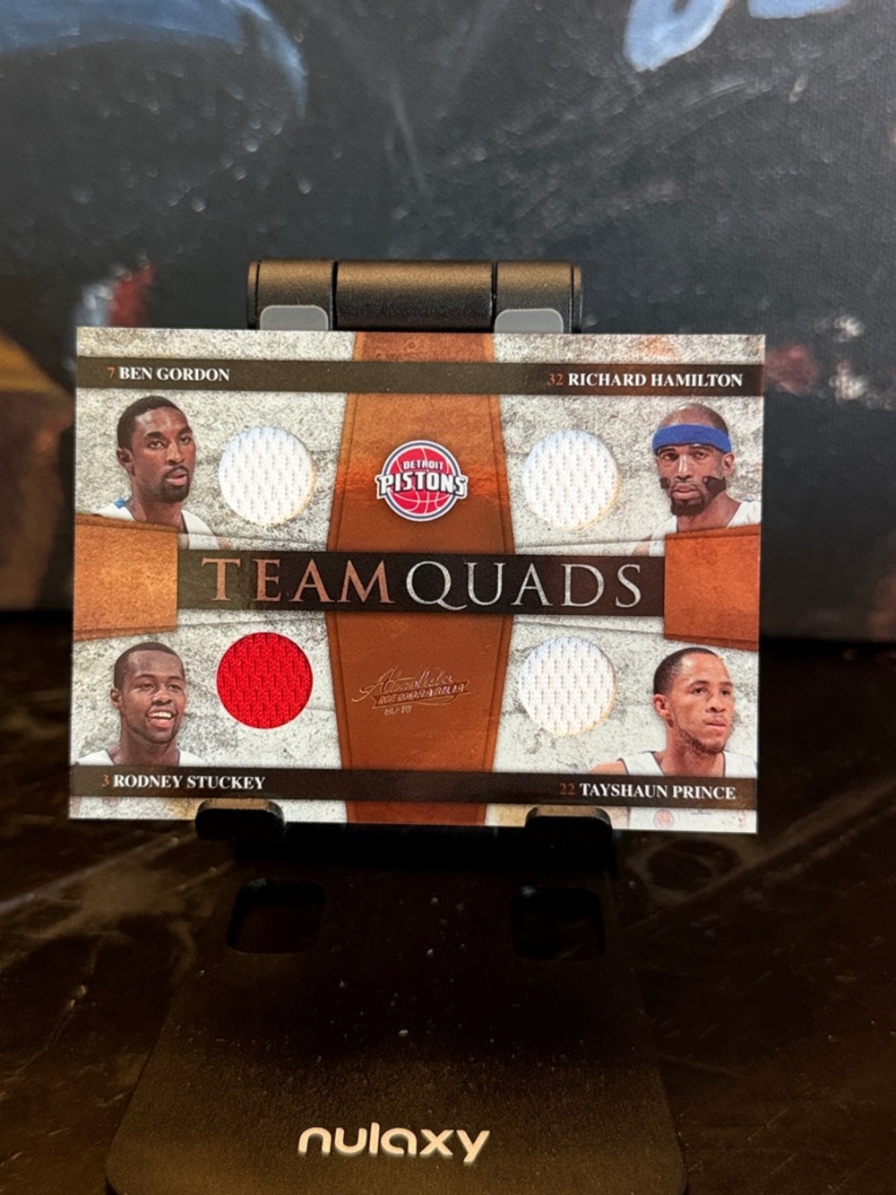 Detroit Pistons Team Quads Game-Used Jersey Card - # 26/100